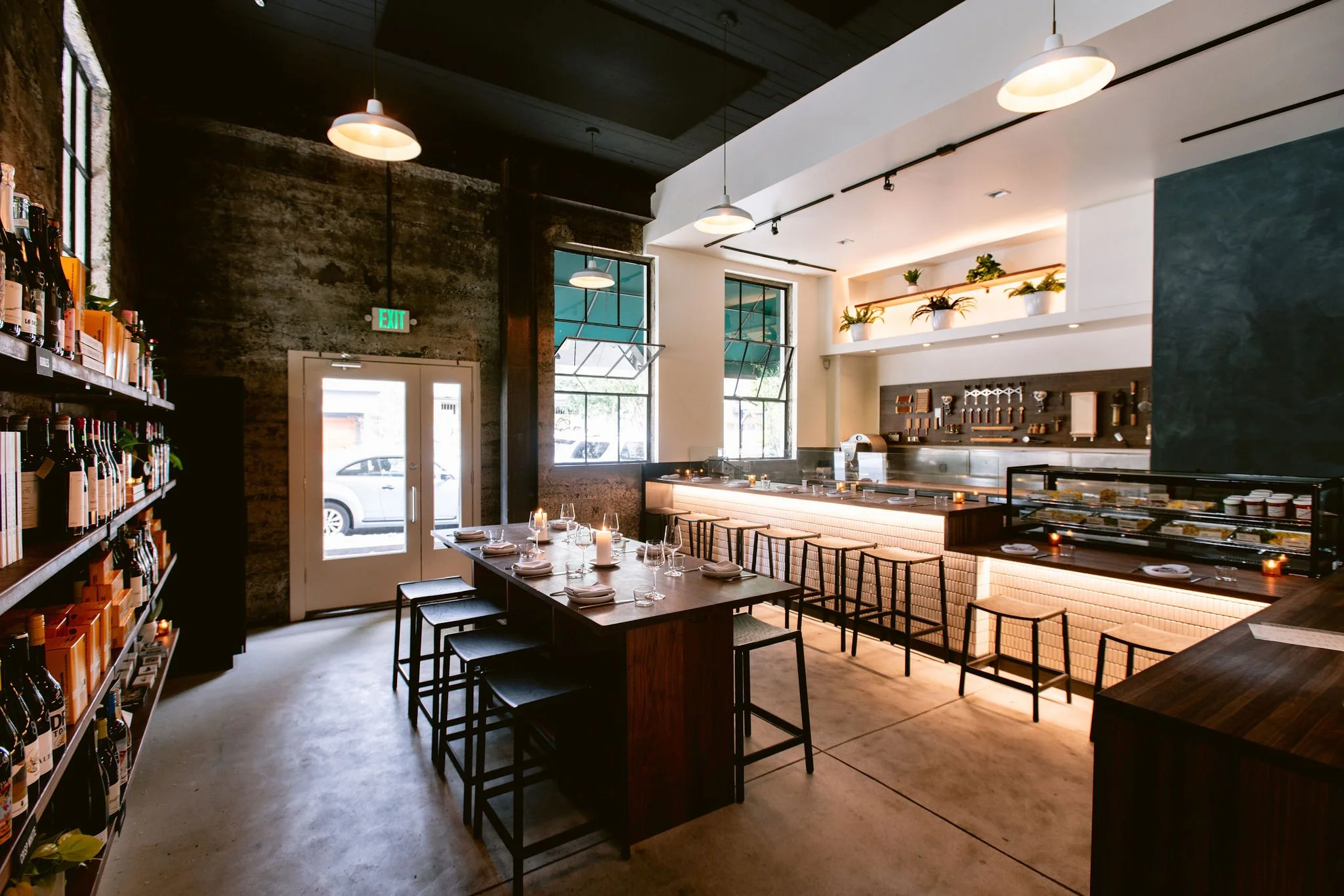 Flour + Water Pasta Shop interior in San Francisco featuring custom wood millwork, counters, shelving, and dining tables by Cookline Millwork Shop