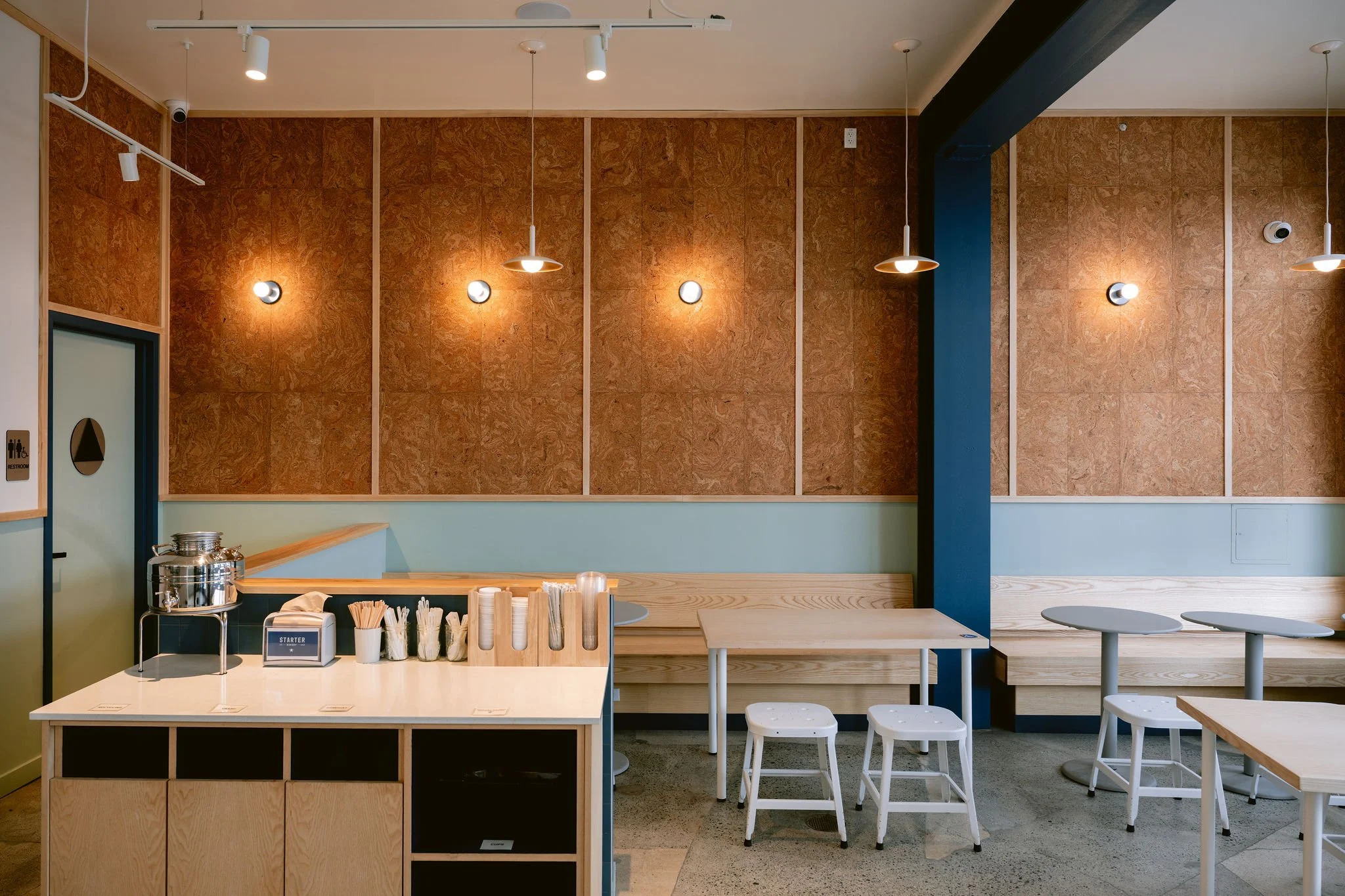 Starter Bakery Albany interior featuring custom cork wall panels and wood trim by Cookline Millwork Shop