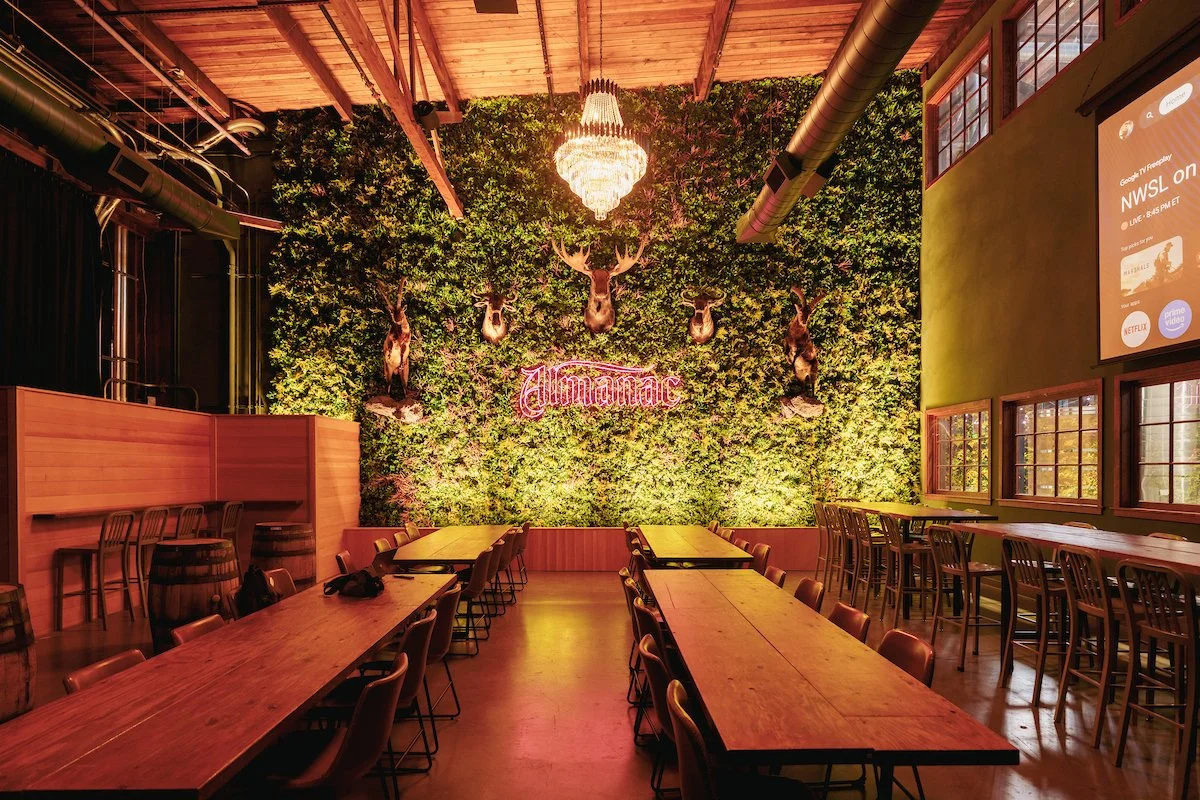 Emerald Lounge at Almanac in Alameda with custom wood wall cladding by Cookline Millwork Shop