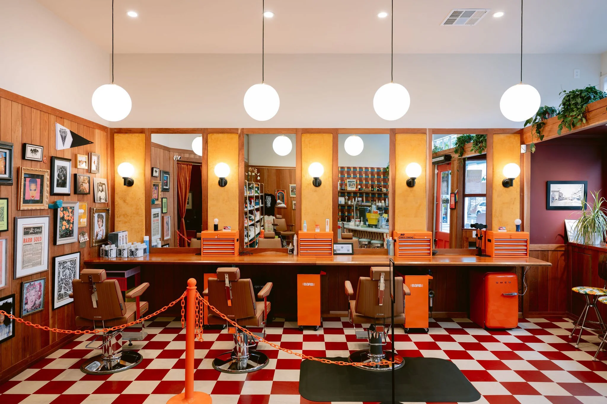 Custom wood counter and wall cladding at The Barb Shop in San Francisco by Cookline Millwork Shop