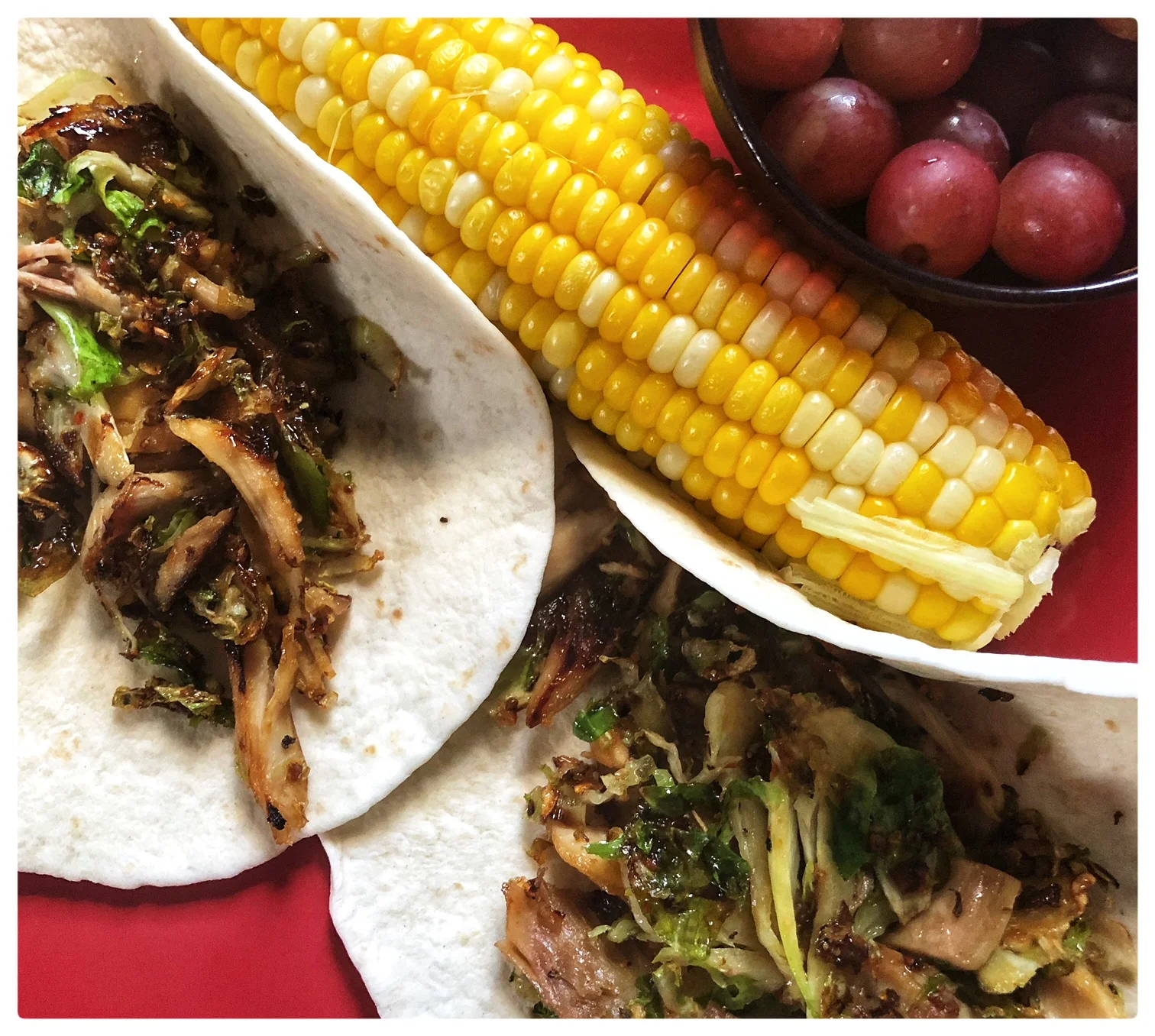 Shaved cauliflower, grilled chicken, vegetables seasoning of choice and a drizzle of honey. Two medium flour tortillas warmed up. Corn on the cob with a cup of grapes on the side (7 WW points)