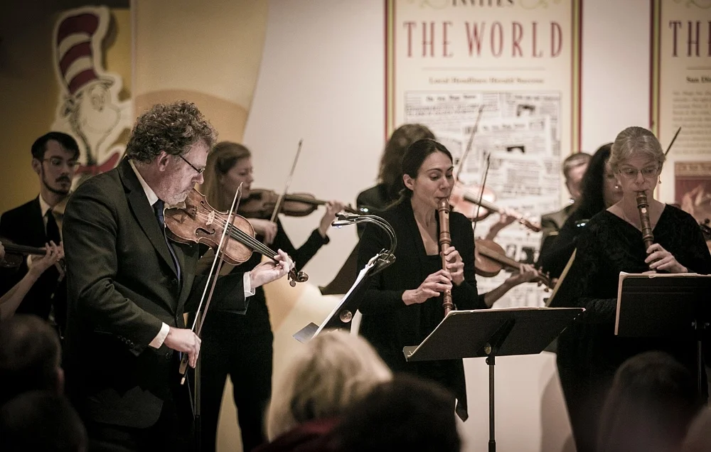 Pierre Joubert, violinist, leads the orchestra