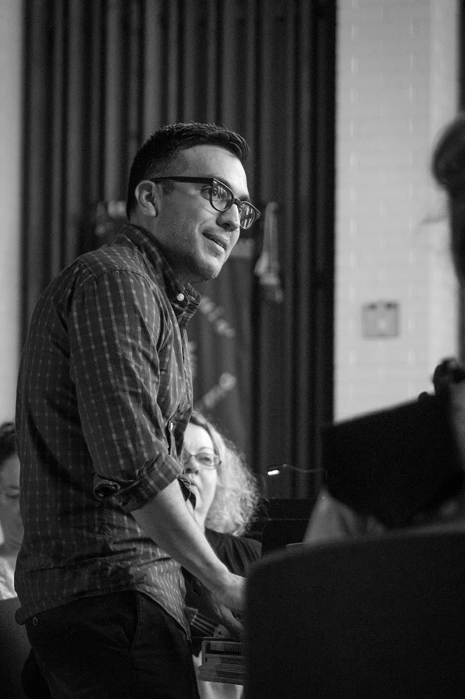 Music Director Ruben Valenzuela in rehearsal.