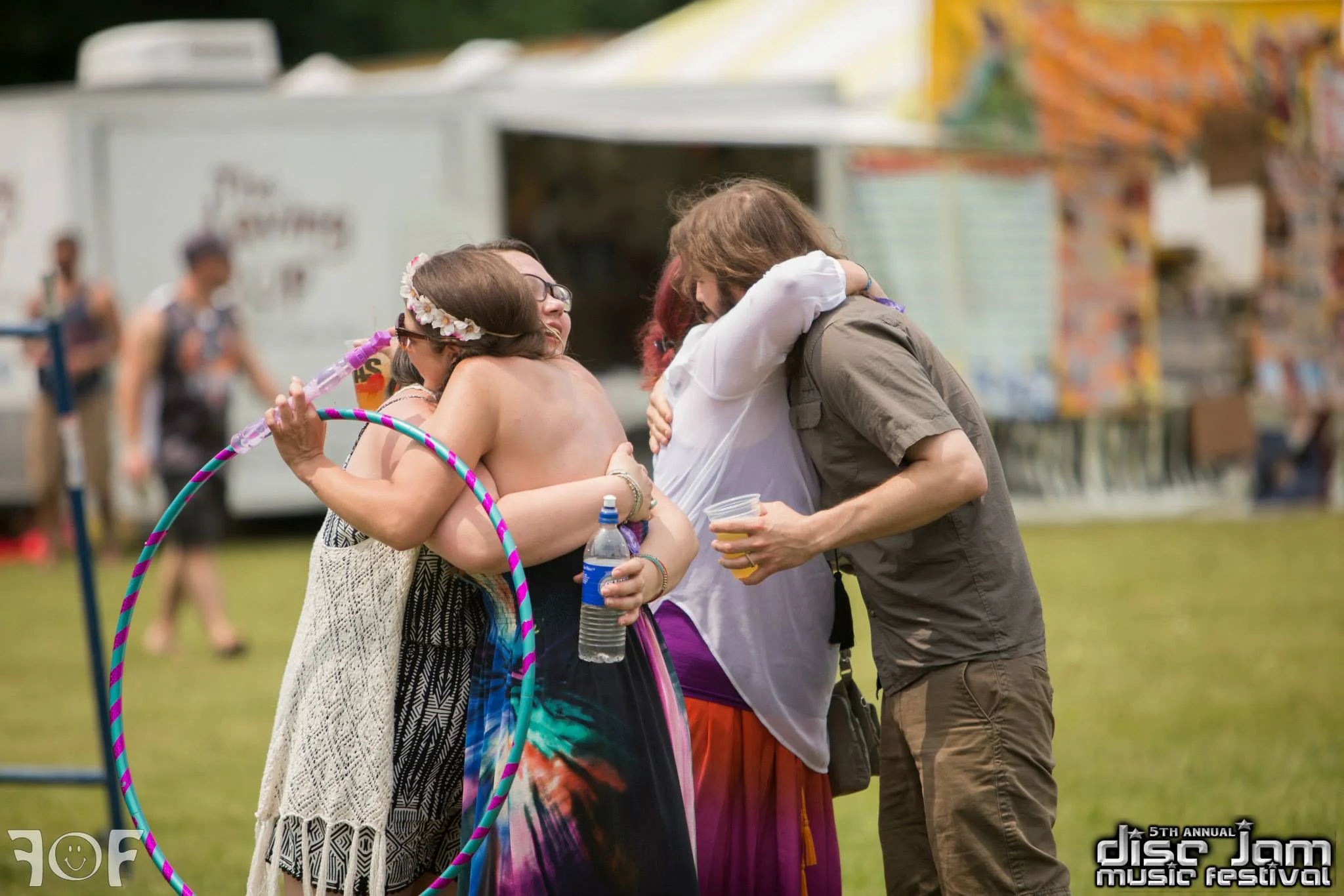 Hugs all around! Source: Faces of Festivals and Disc Jam