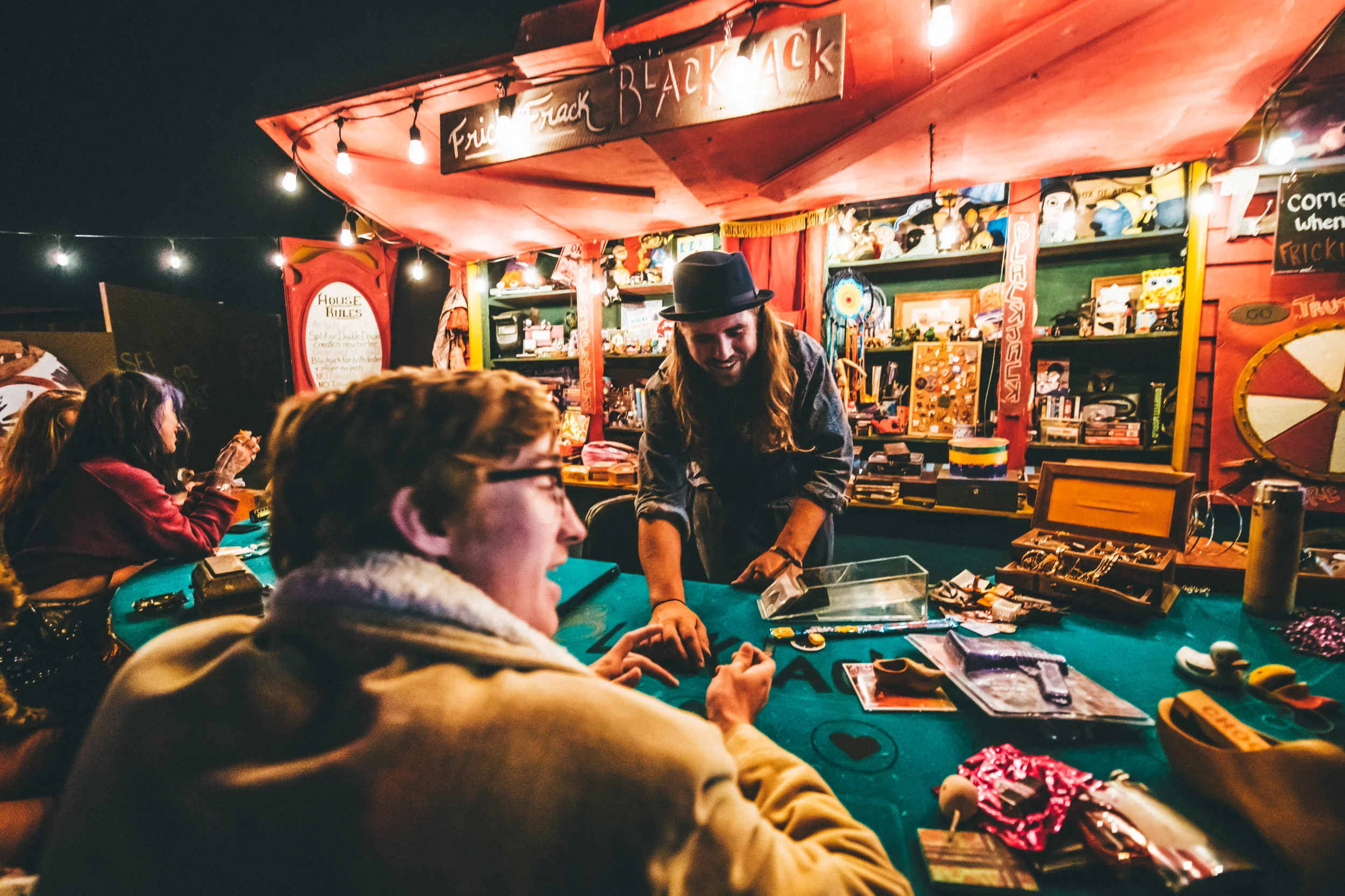 Festival goers play a game of black jack at the Grand Artique 📷: Juliana Bernstein