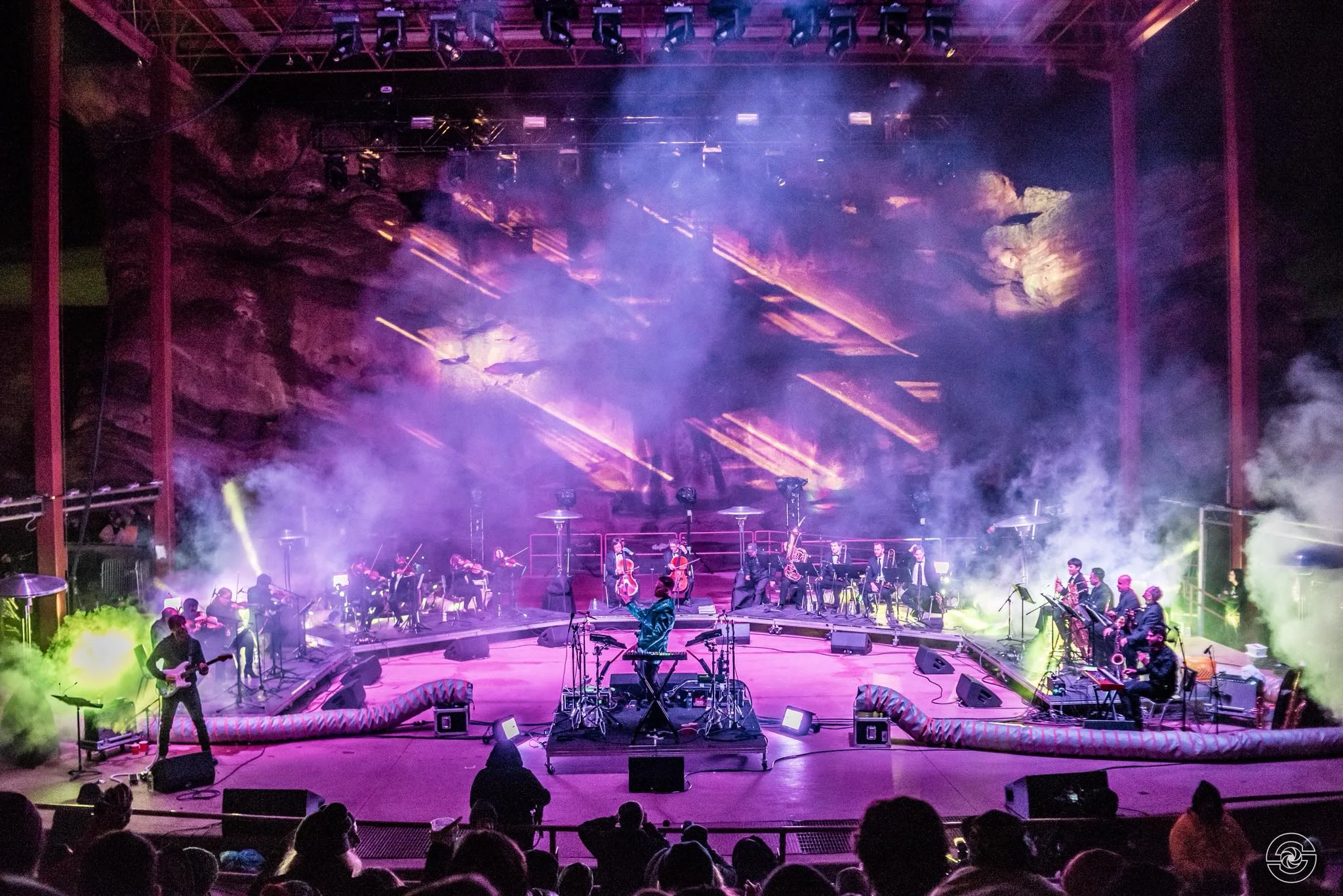 Opiuo peforming with the Syzygy Orchestra at Red Rocks Amphitheater.