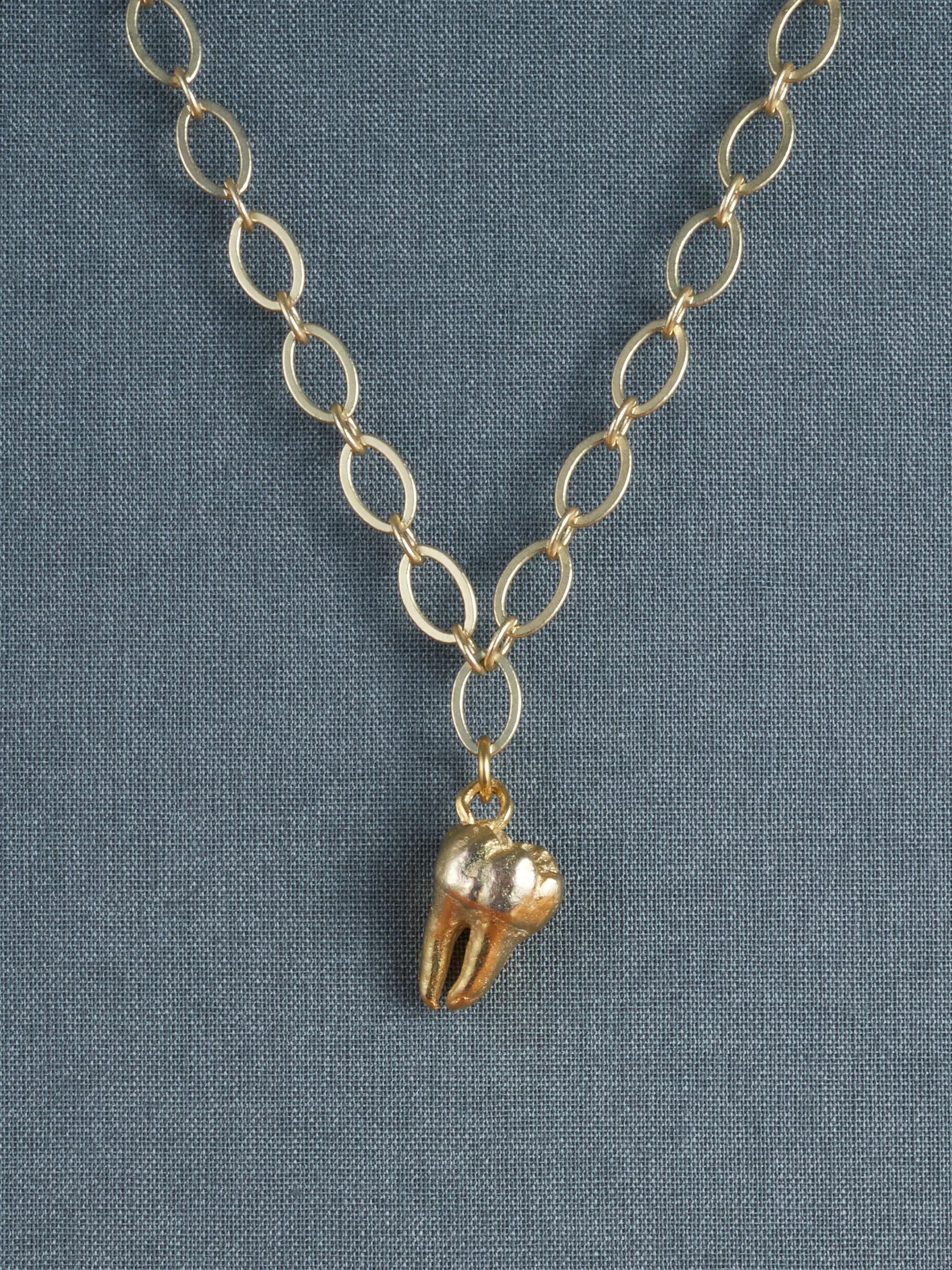 Teeth_0002s_0001_SoloTooth-Gold.jpg