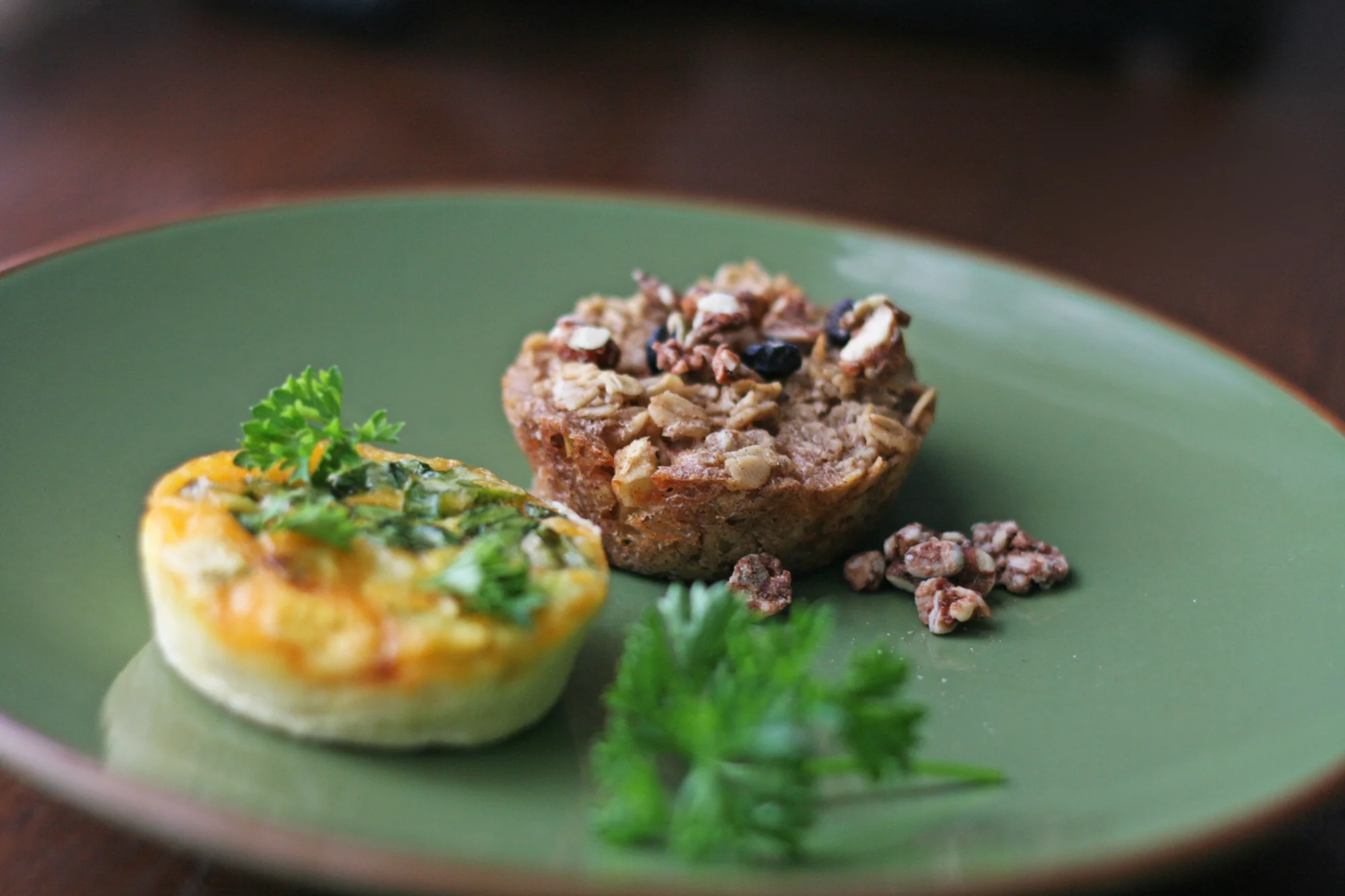 oatmeal-muffin-in-focus-on-green-plate.jpg