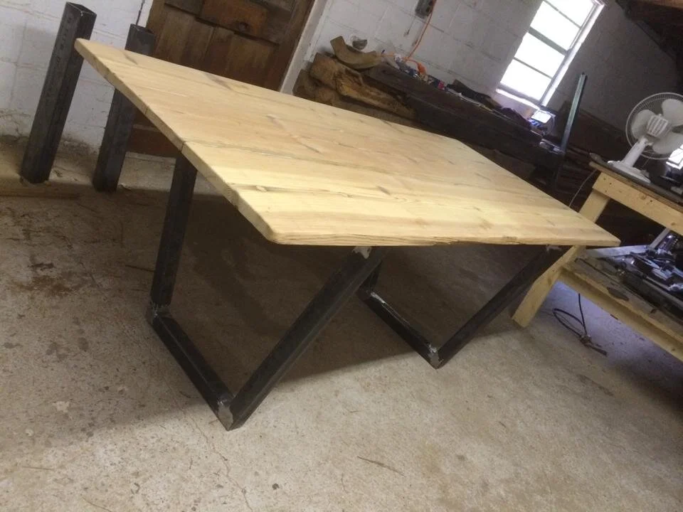 6 ft top trapezoid metal base.jpeg