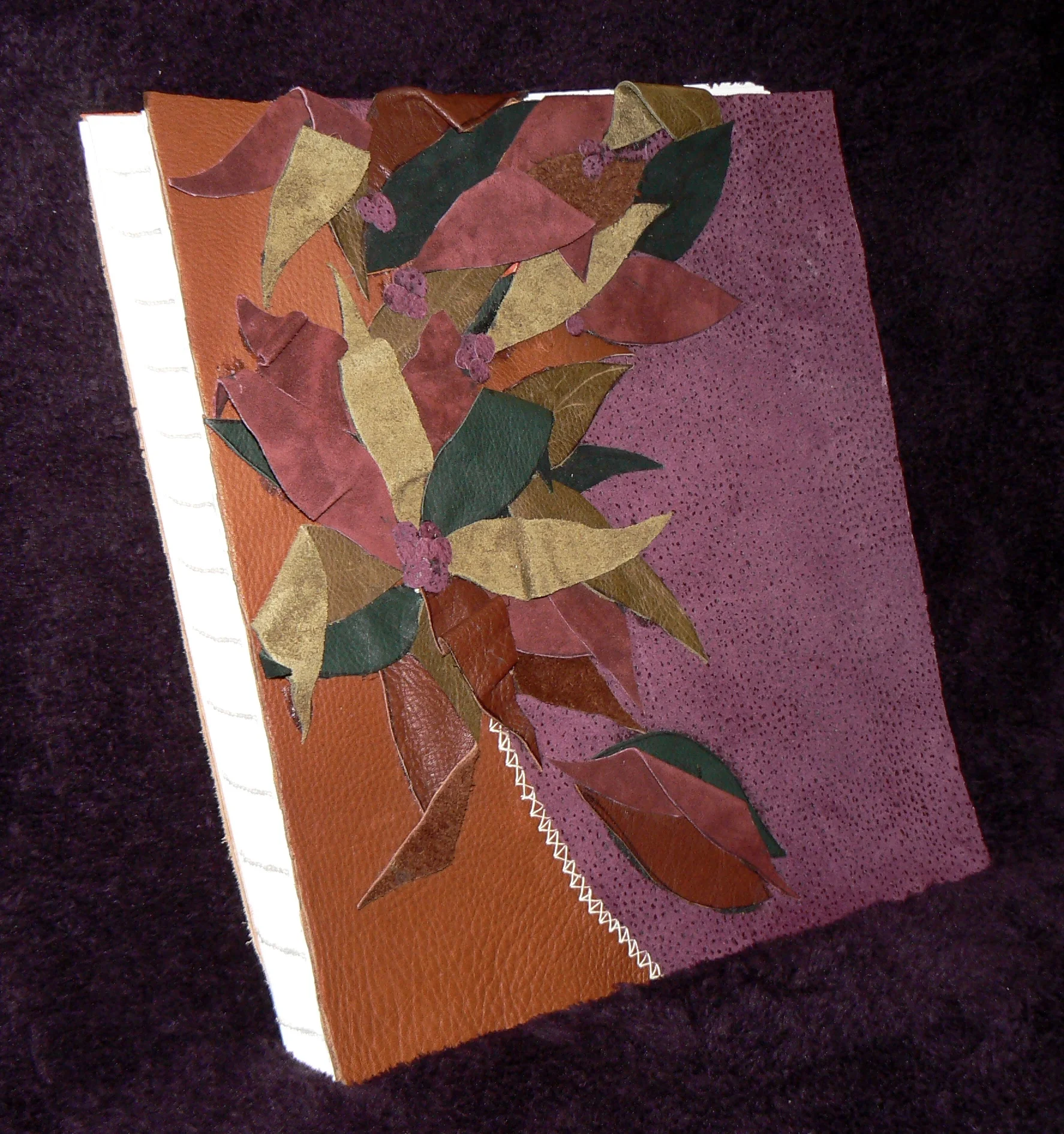 Leather cover and hand-stitched volume, created by Joanne de Biasi, the mastermind behind this project.