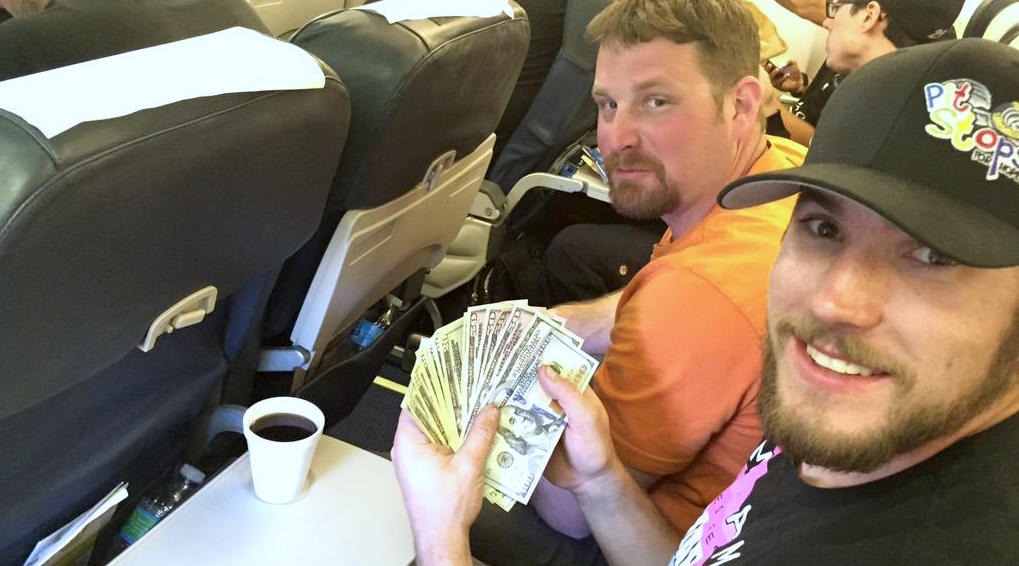 Counting the money to be donated on the plane ride home from Las Vegas Motor Speedway.