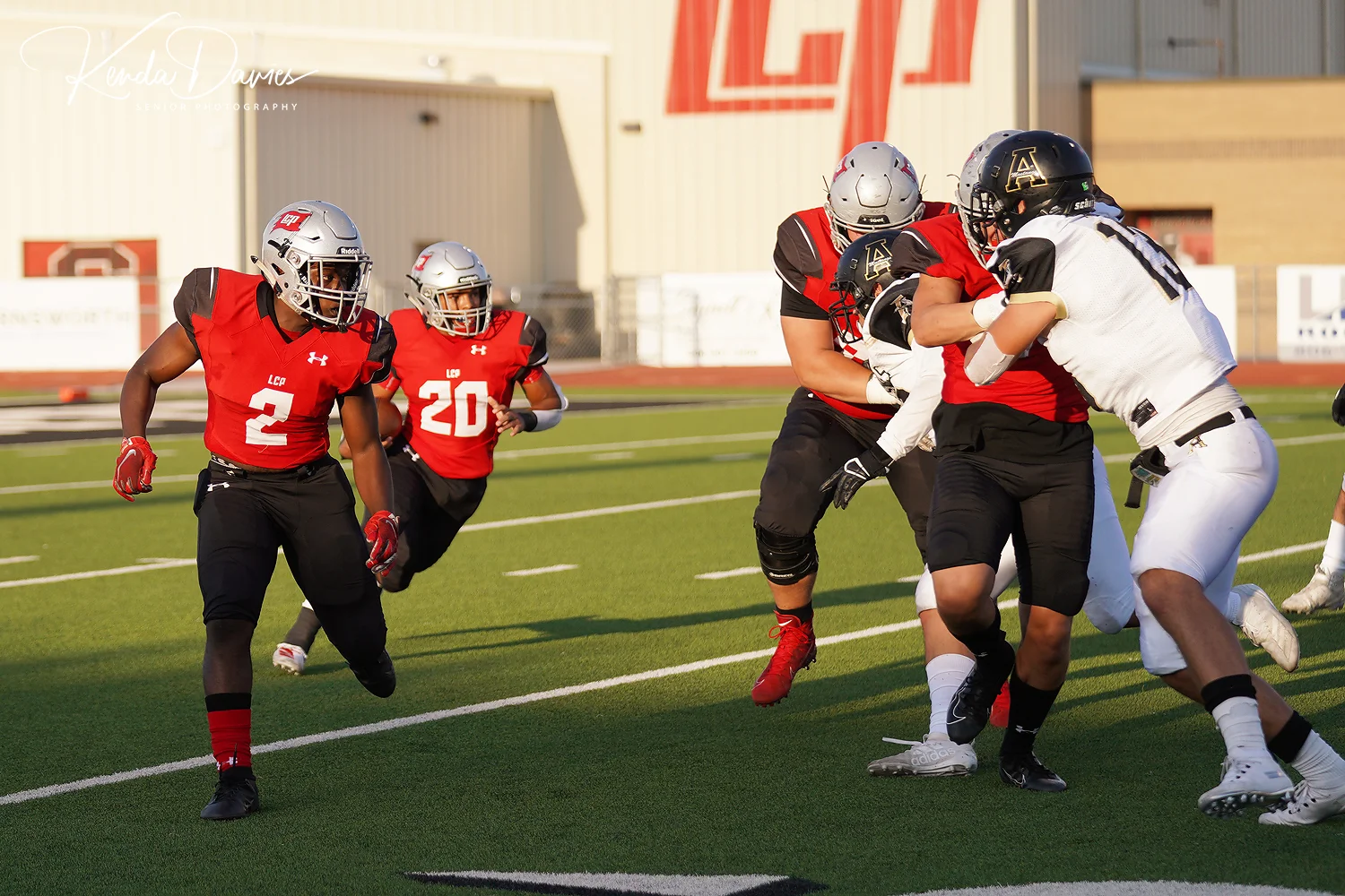 Star senior running back, Tyler Hairston leads one of his newest teammates, stand out Nehemiah Martinez into a den of defenders getting swallowed by the o-line.