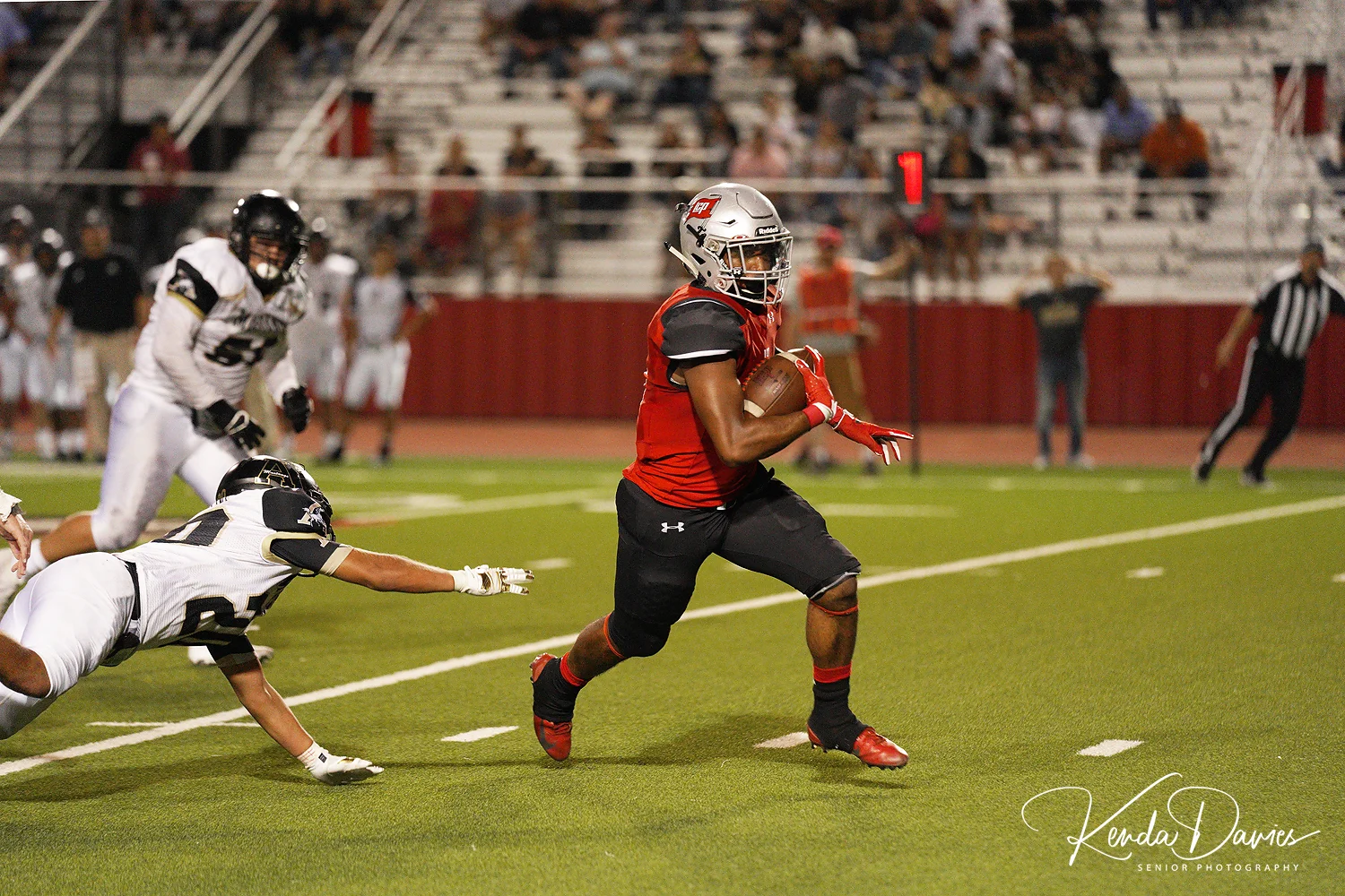#3 Johnson leaves his opponents on the turf as he races to yet another touchdown.