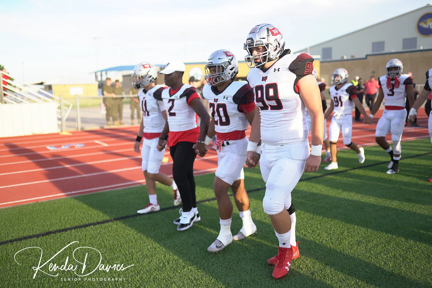 Team Captains prepare to take the field for the coin toss.