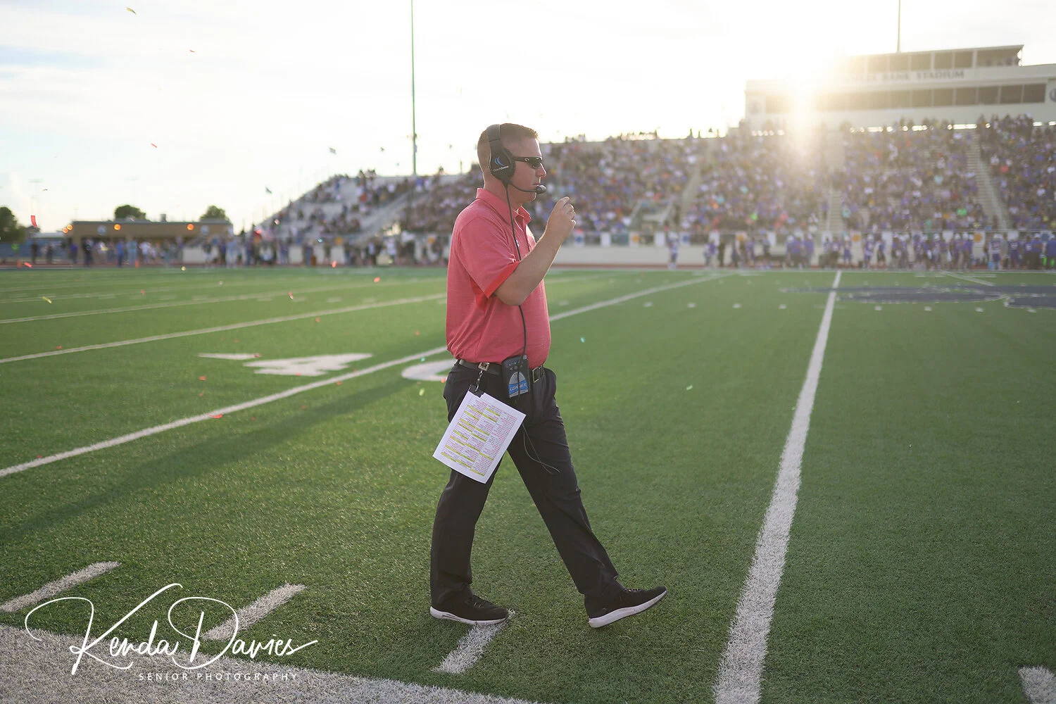 Head Coach, Chip Darden, watches his defense as the confetti flies around him that was tossed by the Pirate’s student section at kickoff.