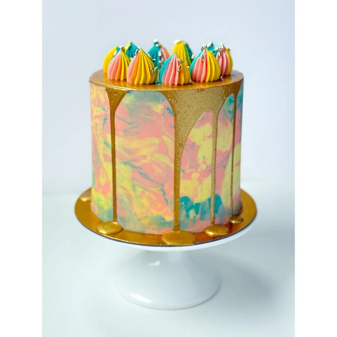 Cake #7 of 2026: Three layers of chocolate cake filled with chocolate buttercream, caramel ganache, and a caramel crunch. Decorated in light pink, light yellow, light blue and gold for a 12 year old's golden birthday 🎂👑⁠
.⁠
.⁠
.⁠
.⁠
.⁠
.⁠
.⁠
.⁠
.⁠
