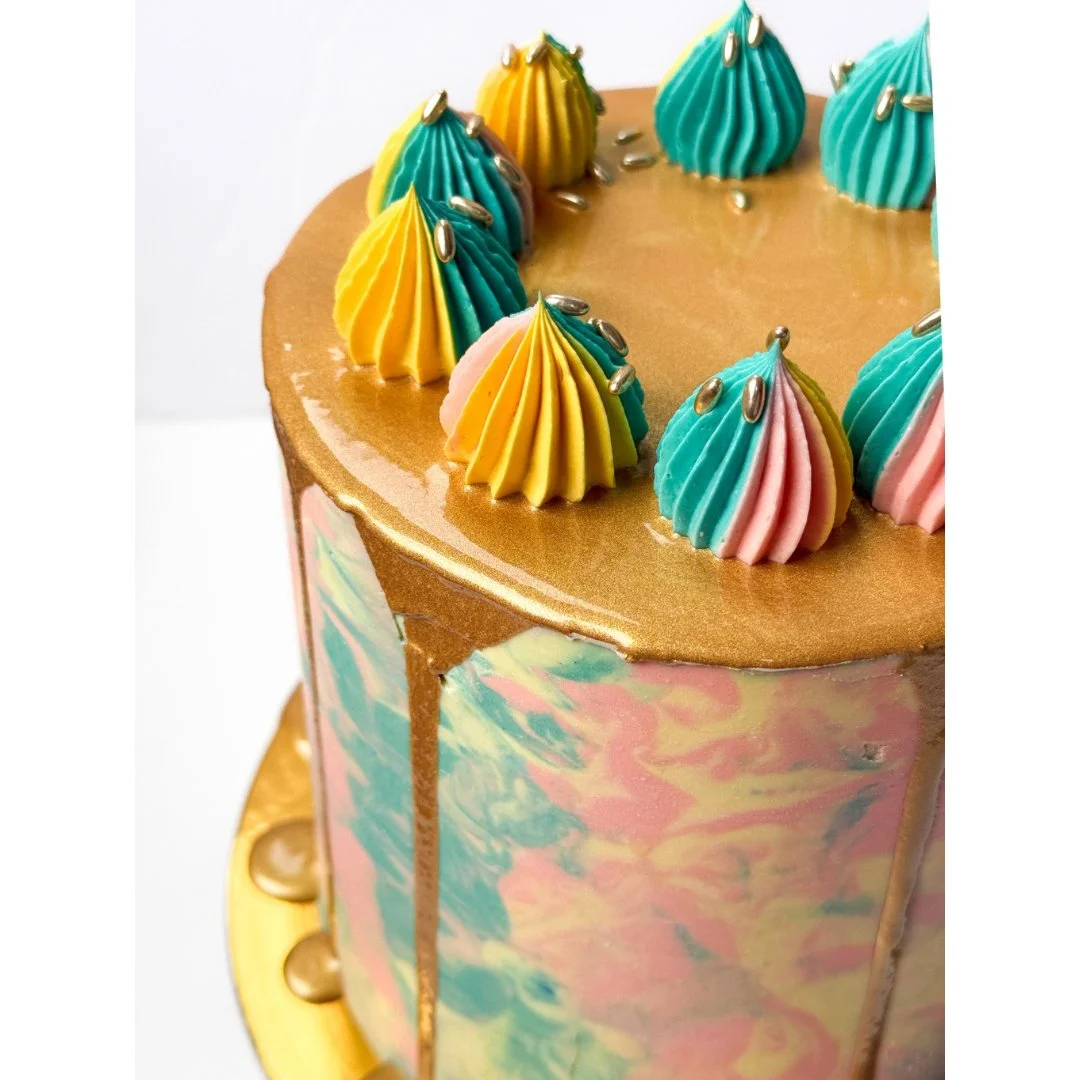 Cake #7 of 2026: Three layers of chocolate cake filled with chocolate buttercream, caramel ganache, and a caramel crunch. Decorated in light pink, light yellow, light blue and gold for a 12 year old's golden birthday 🎂👑⁠
.⁠
.⁠
.⁠
.⁠
.⁠
.⁠
.⁠
.⁠
.⁠
