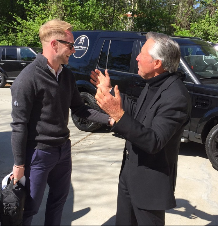 Happy hubby and Gary Player having banter outside before heading off to the course. 