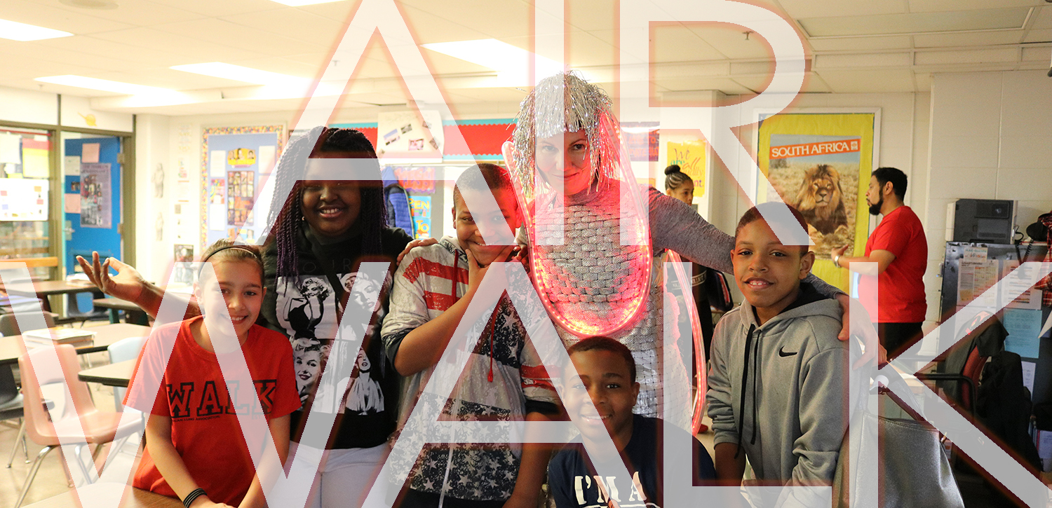 Photo of artist Dominique Paul working with students at Meyzeek Middle school.&nbsp;