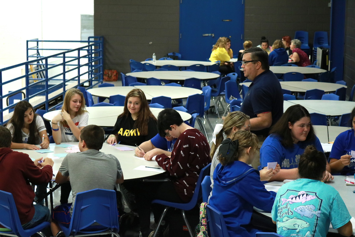 Artist Jay McCoy from Lexington, KY works with students at Breathitt Co. High School.