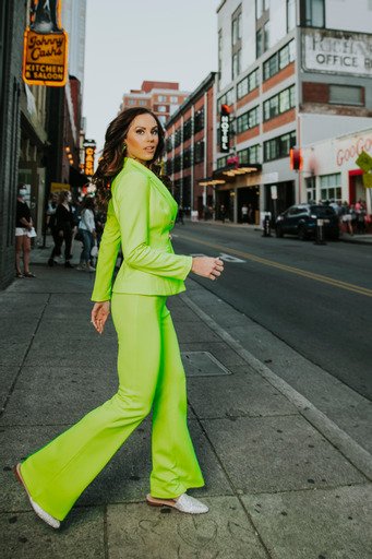 Amber Carroll Green outfit in city.jpg