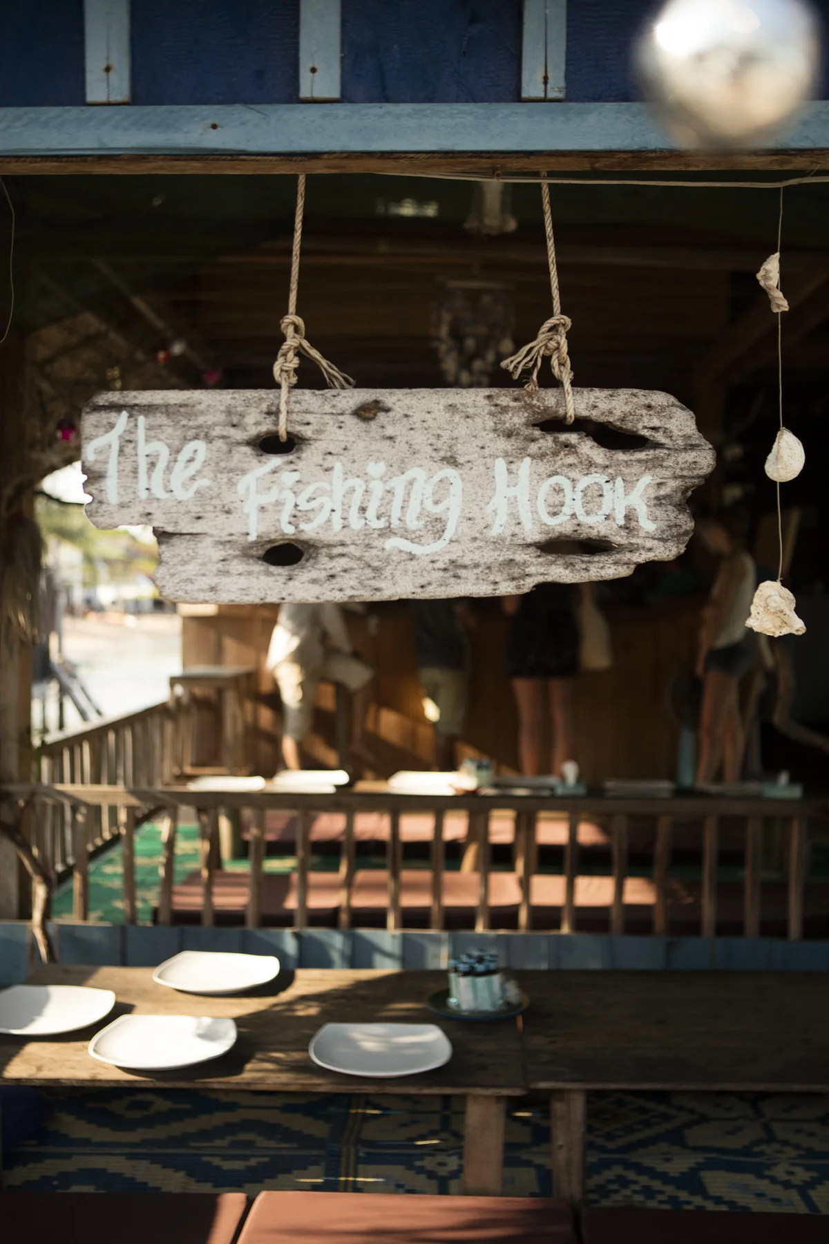 The sign of "The Fishing hook". Eating here includes social eating, you sit together with the other gusts.