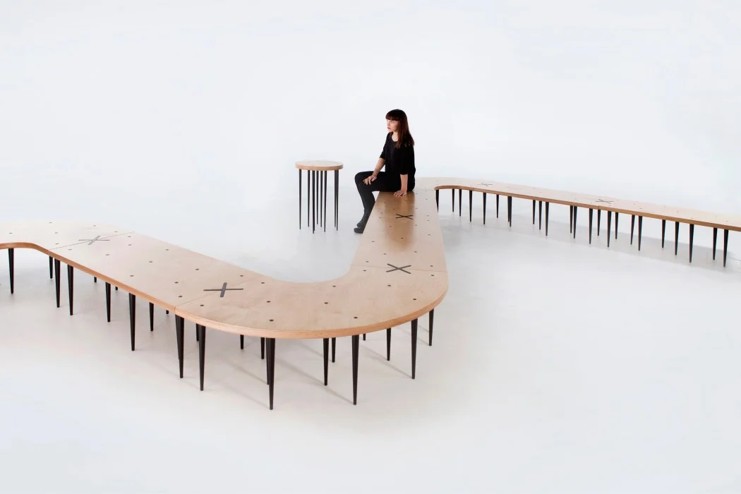 CENTIPEDE SEATING MODULES CONNECT WITH AN INLAID “X”.