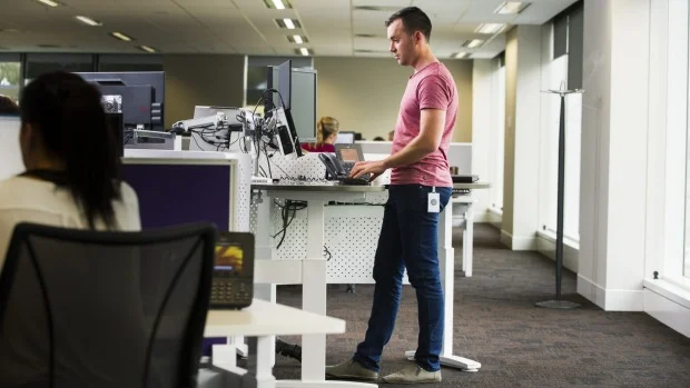 Renewed call for office workers to embrace stand up desks
