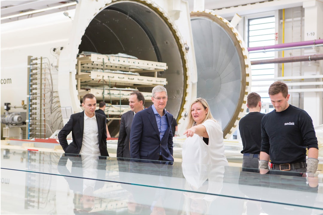 Apple’s CEO Tim Cook looks over the production process; image via seele .