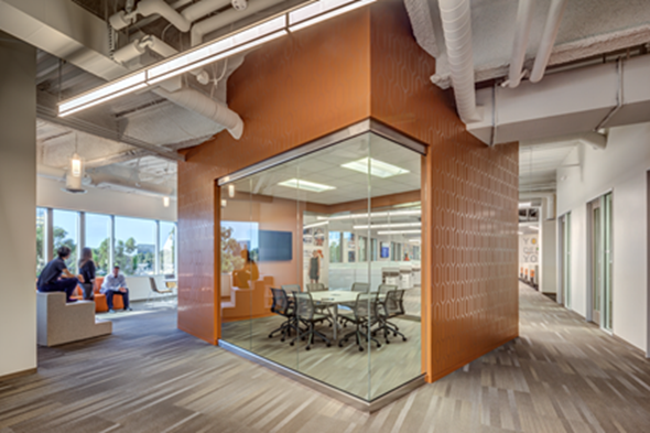 As a part of the pre-occupancy evaluation for TriPointe Group, H. Hendy Associates examined the company’s migration patterns, resulting in a glass enclosed meeting room and collision area located on a main pathway. The space is designed to foster a sense of transparency and inspire team collaboration. Photo Credit: Takata Photography