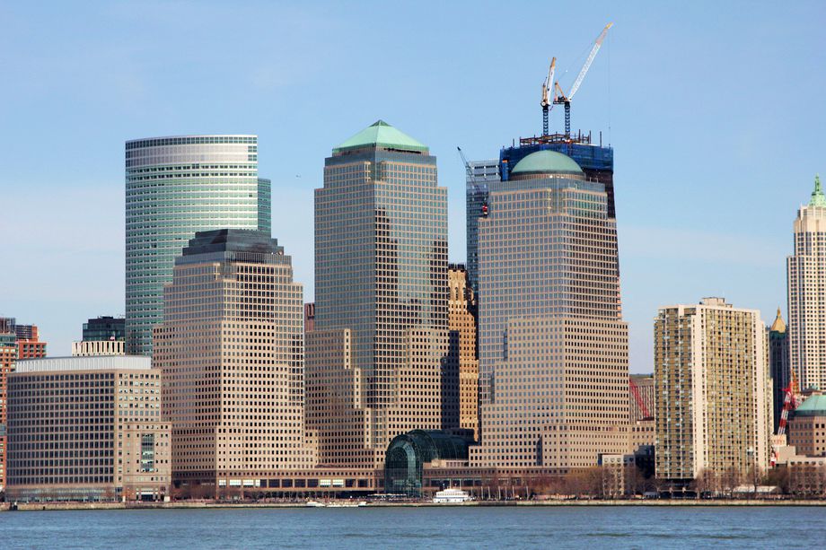 World Financial Center, now known as Brookfield Place, as seen in April 2011, with One World Trade Center under construction in the background.