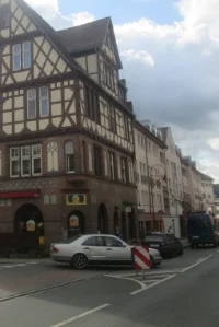 A more contemporary street in Marburg flanked by a half-timbered building