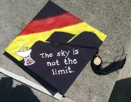 My mortarboard from my graduation from Dickinson. A nod to Germany with a German-flag-inspired sunset behind a mountainous backdrop for the Effelsberg Telescope.