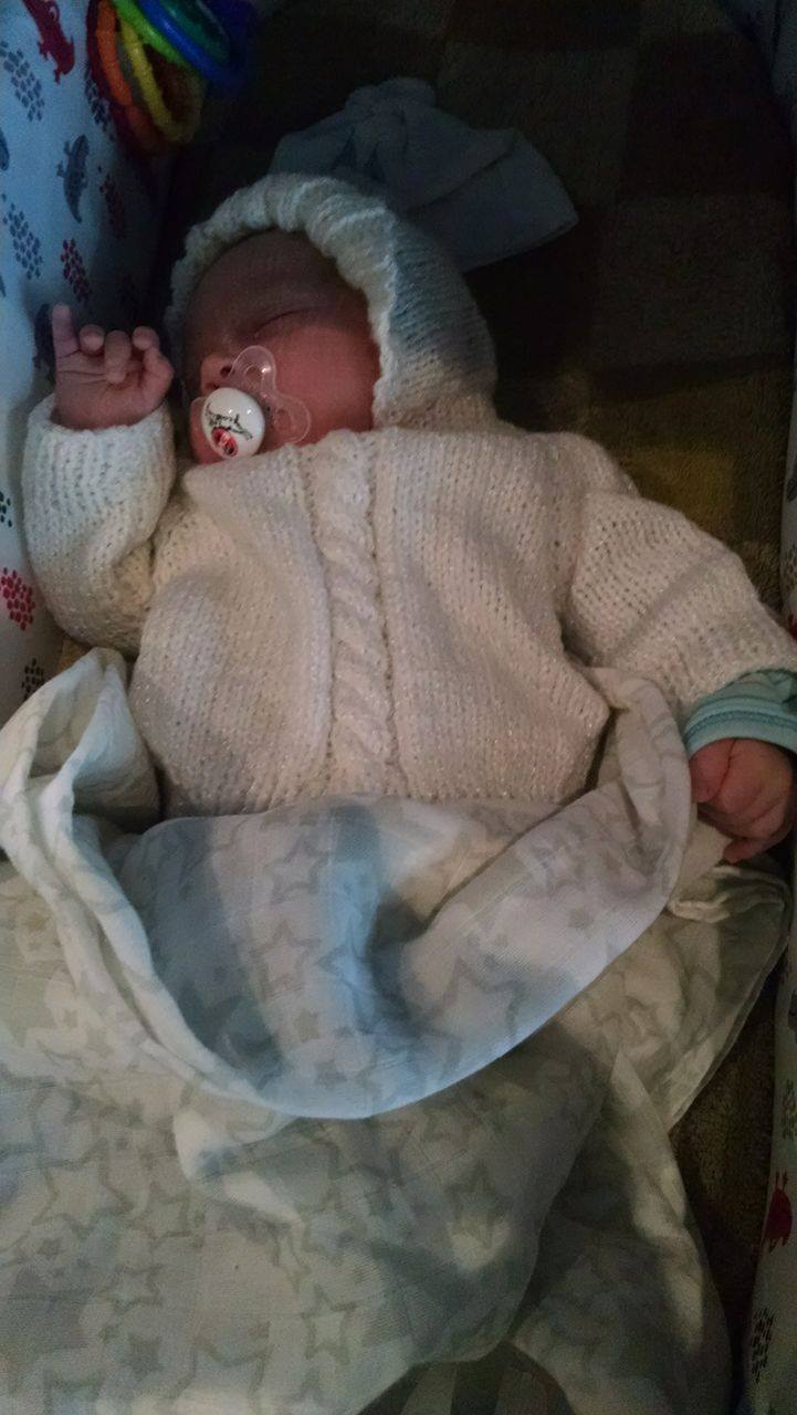 Guenther on one of our many walks in Koeln, bundled up on a rainy day in the sweater made for him by my Nana.