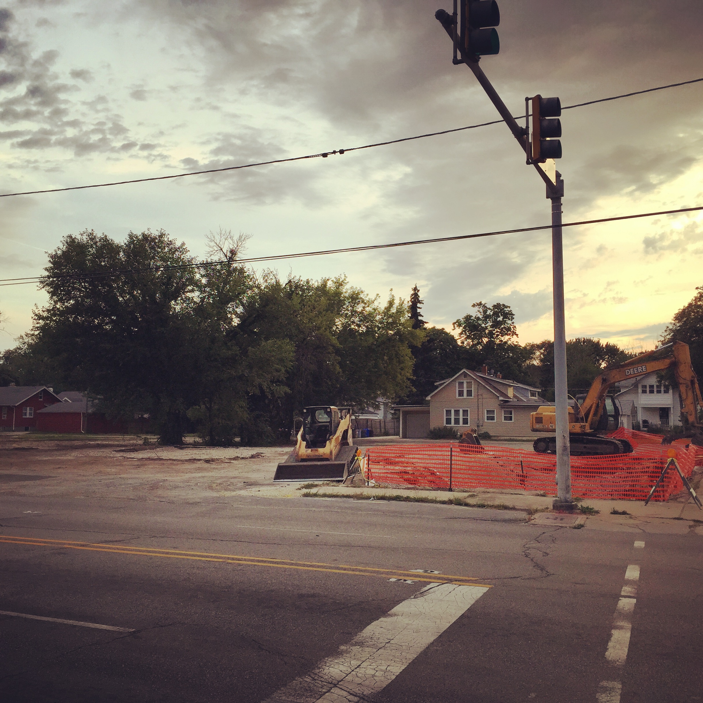North Main and Fulton looking west, taken standing in front of Olympic Tavern. Former site of an insurance office, hair salon, clock repairman, tailor (further to south), barbershop (northeast corner of this intersection), and other homes and businesses. Removed to widen and slightly alter route of North Main (Rt.2). 