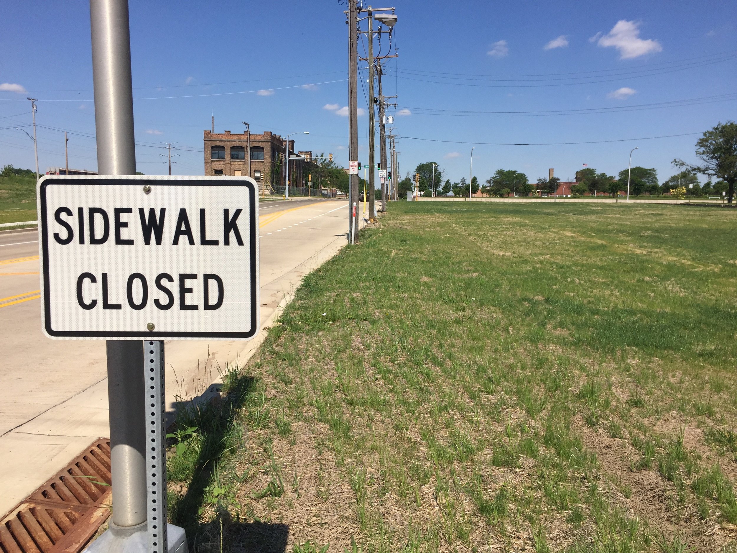 Same intersection. Taken one month after demolition. No sidewalk left...but, lest you forget: That sidewalk is still closed.