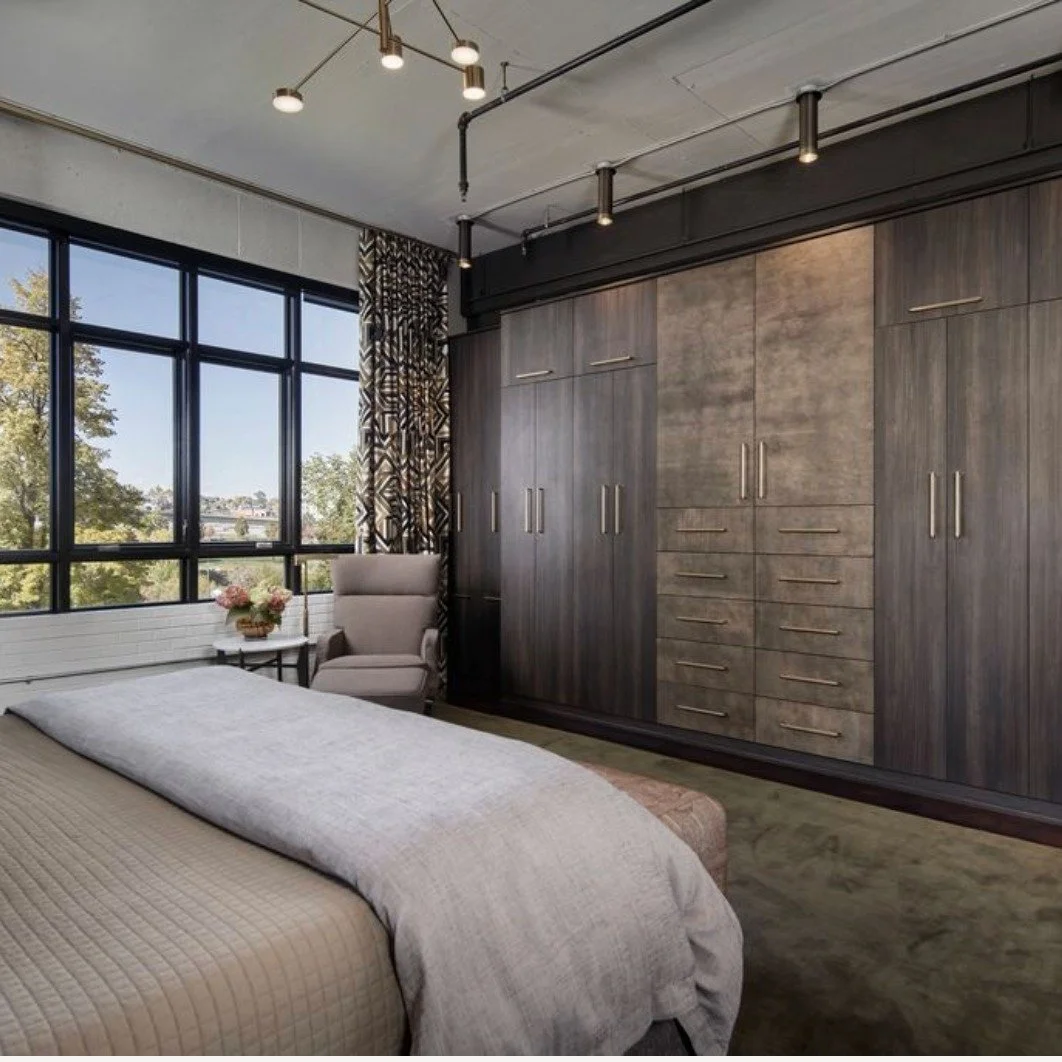This moody primary bedroom embraces an earthy, organic palette that mirrors the park outside. Layers of texture and pattern - velvet, shagreen, wool and dark wood create depth and warmth, while deep taupes, moss green, sienna and rich browns evoke th