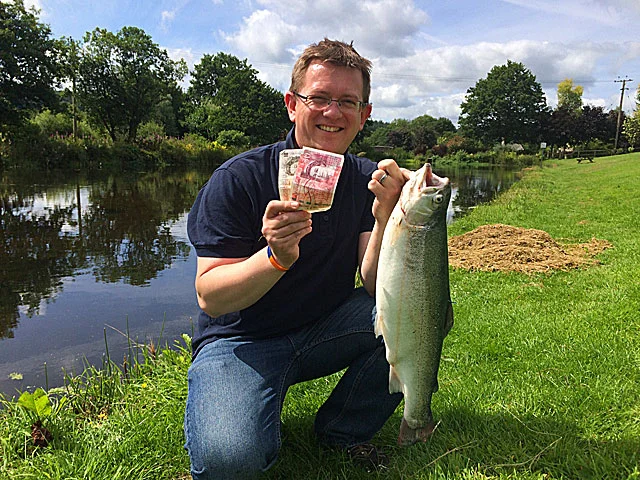 (Above) Tim Nickel with a cracking Blue Trout on a Cats Whisker and £60 in his back pocket!