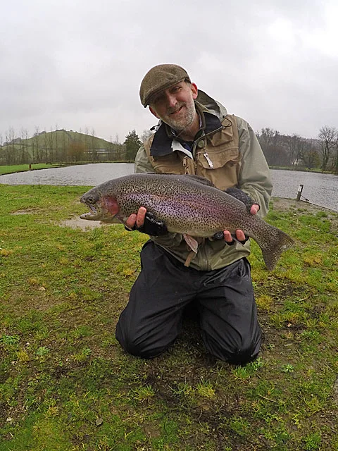 Patrick Silk with a 7lb Rainbow landed on a 6 weight rod
