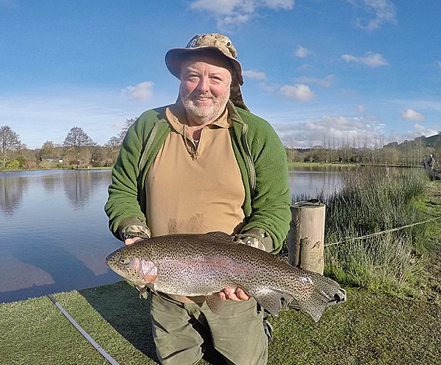 Paul survived the pressure to land an 8lb 14oz Rainbow under a perfect Blue December sky.