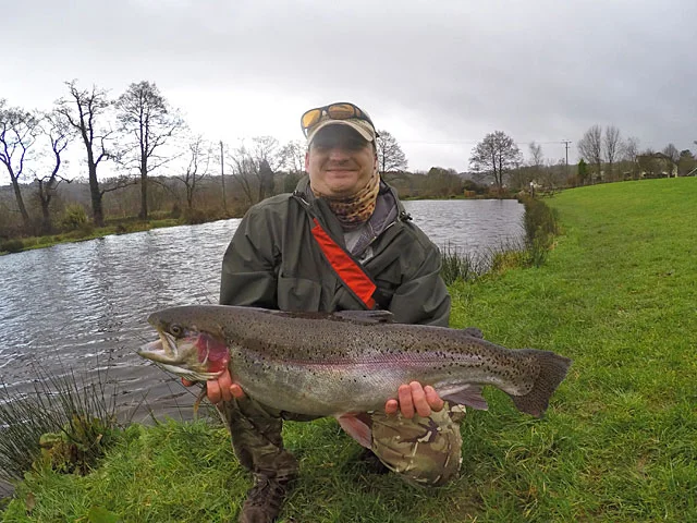 Shaking from head to toe - A very happy Lukasz Adamczyk with his personal best 12lb Trout caught with a home tied UV Olive Bead Head Nymph.