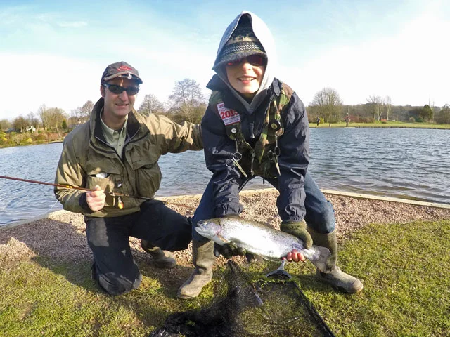 Proud Dad - Dean Mockridge with his son James and the Trout which helped him to win the 2016 Exe Valley Junior Troutmasters Fish Off