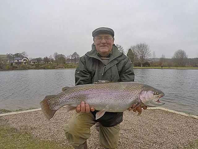 Happy Angler - Mike Ellis with the best Rainbow Trout of the month so far - 10lb 12oz