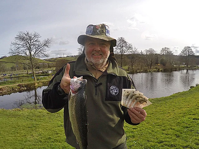 £50 Winner! Paul Grisley with his tagged Trout and a fist full of cash.