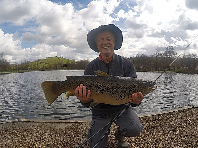 Elated angler Dr Mike Webster with his 14lb 10oz fishery record Brown Trout. Nice work!