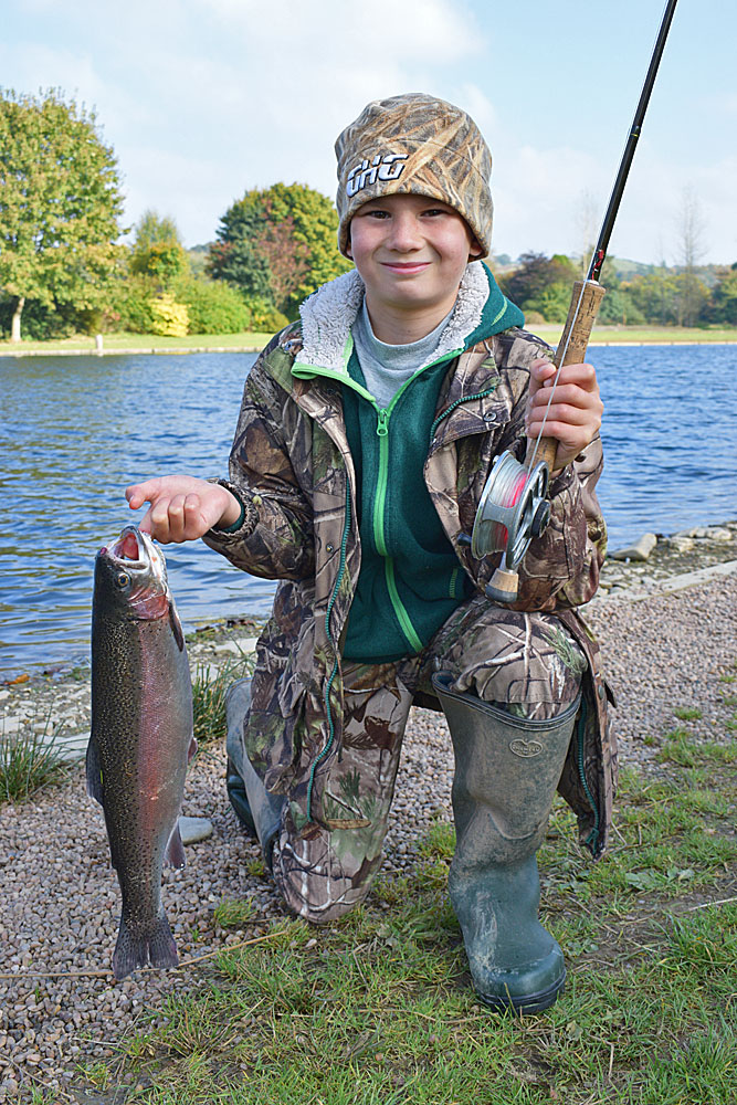 A very happy lad! Charlie Cooper, age 10, with his third placed Trout
