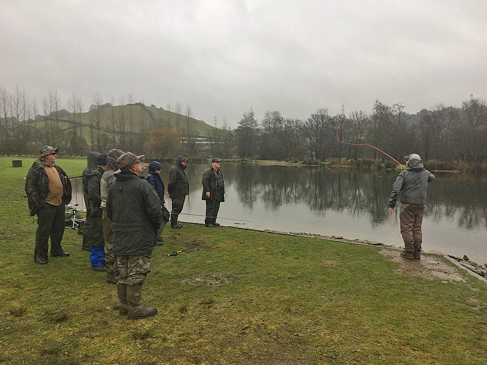 Anglers gather on the banks of Anchor Lake for one of the demos at the recent catch & release day at Exe Valley Fishery.