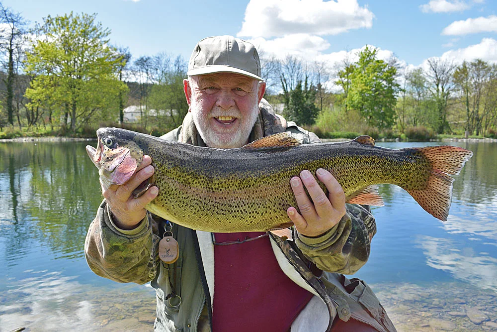 Mr Gilbert from Barnstaple with his 9lb 1oz Rainbow which he caught using a Dry Fly!