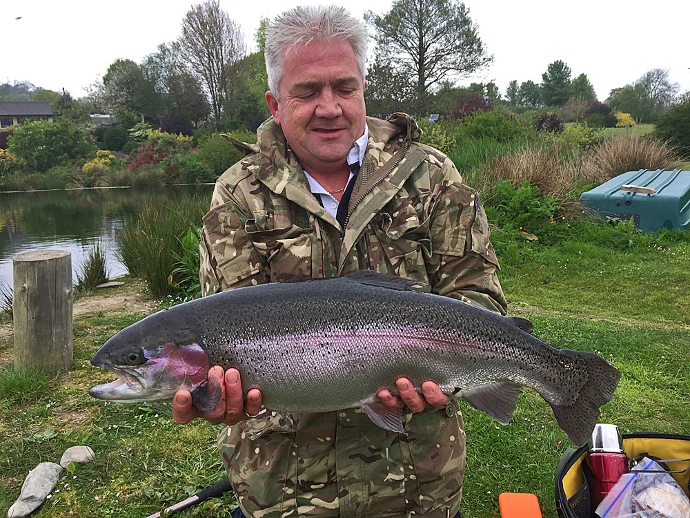 Rick Price with a fin perfect slab of a Rainbow Trout caught while fishing Anchor Lake