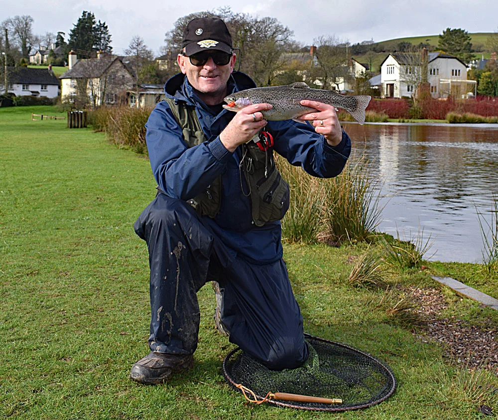 Chris Comber with his fin perfect Rainbow Trout caught on an Orange Blob